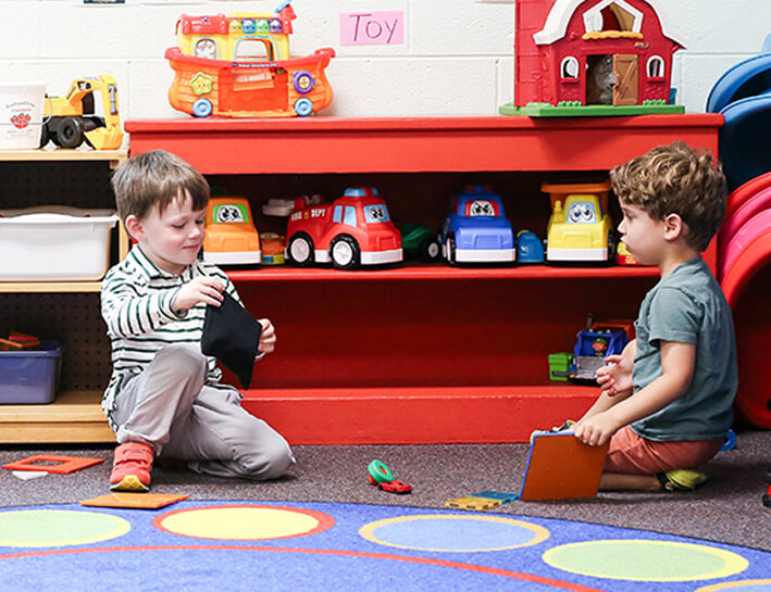 Toddler boys playing with toys